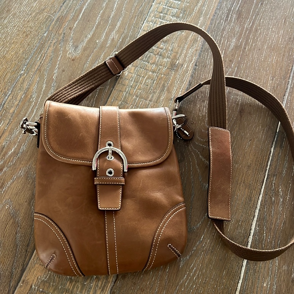 Tan, Leather Coach crossbody with canvas strap.